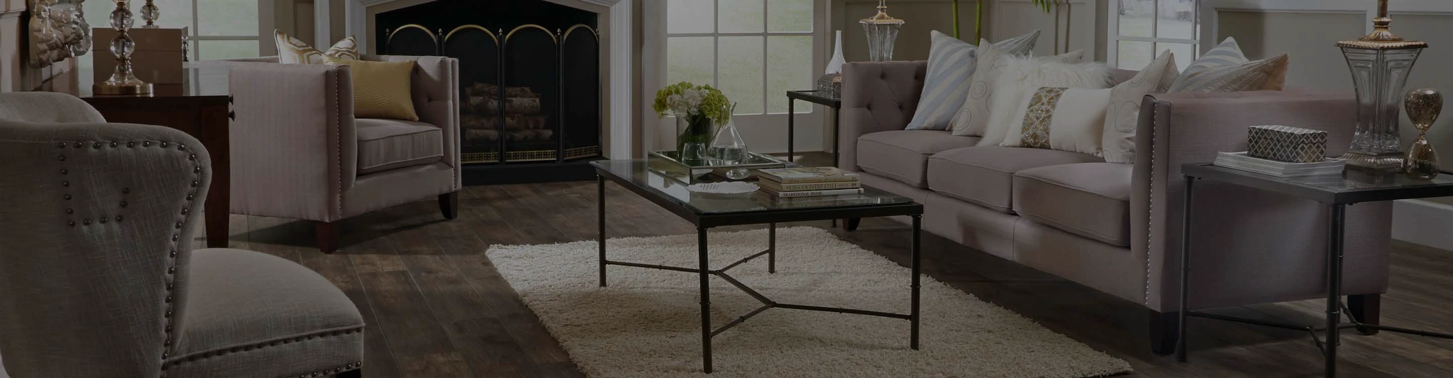 Laminate flooring in living room with furniture and fireplace