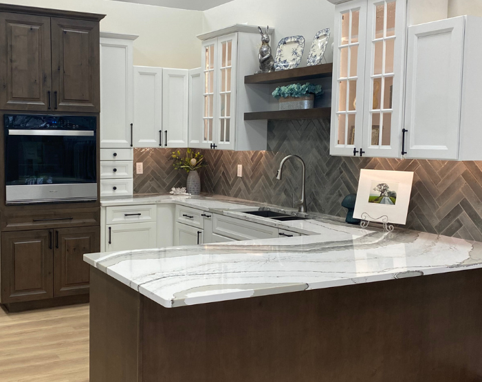 Gray tile backsplash in a kitchen behind a stove