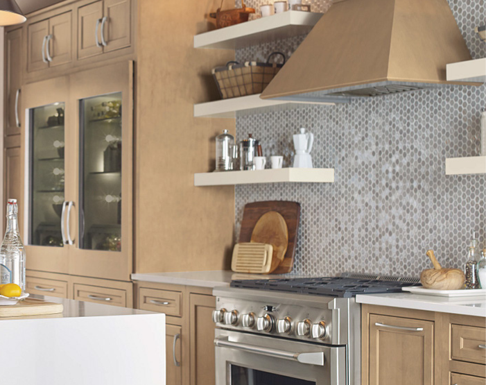 Gray tile backsplash in a kitchen behind a stove